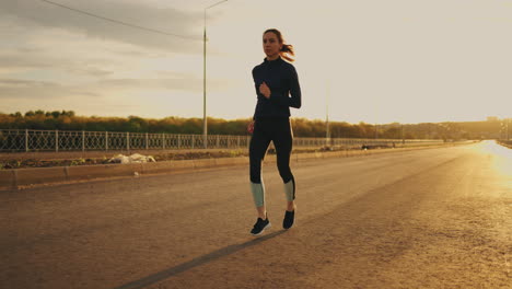 yougn-woman-in-sportswear-is-jogging-in-sunrise-or-sunset-healthy-lifestyle-of-modern-youth